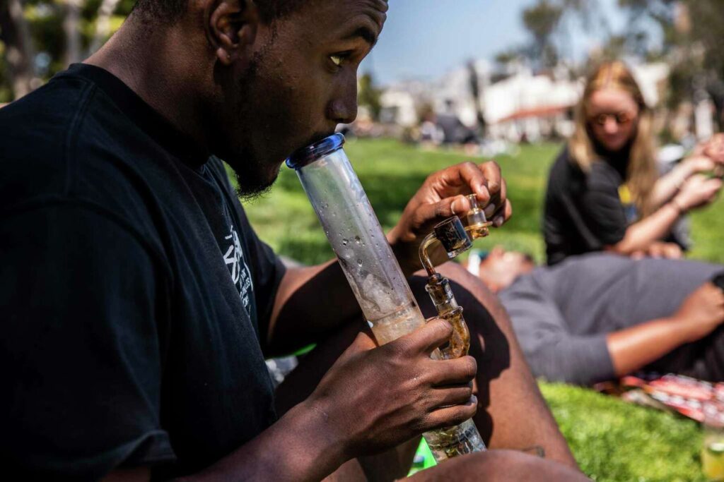 Man smoking a cannabis bong
