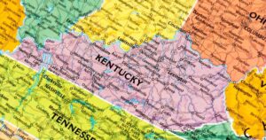 Colorful road map highlighting Kentucky in pink, surrounded by neighboring states, with major cities, highways, and landmarks clearly labeled, symbolizing the focus on Kentucky cannabis decriminalization efforts