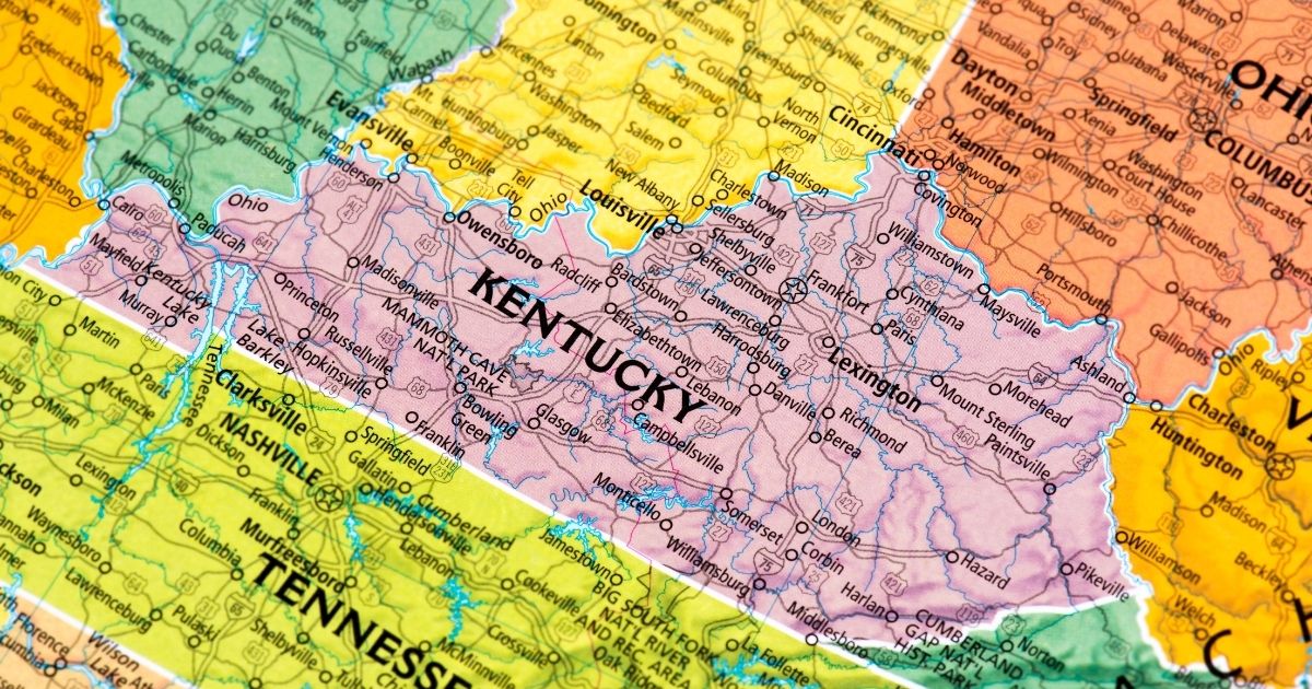 Colorful road map highlighting Kentucky in pink, surrounded by neighboring states, with major cities, highways, and landmarks clearly labeled, symbolizing the focus on Kentucky cannabis decriminalization efforts