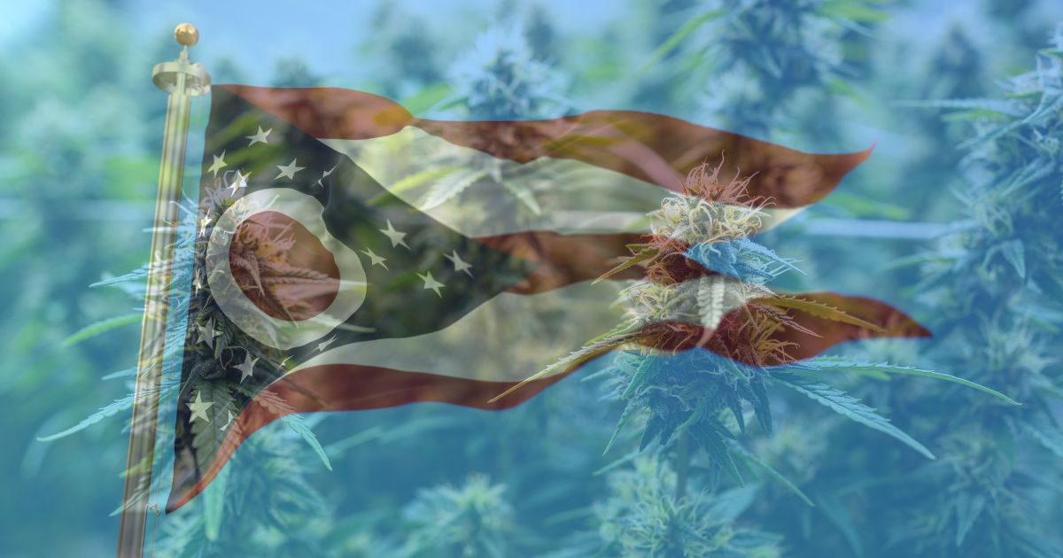 Composite image of the Ohio state flag waving over a translucent background of vibrant green cannabis plants, symbolizing the ongoing Ohio cannabis referendum and its connection to state legislation