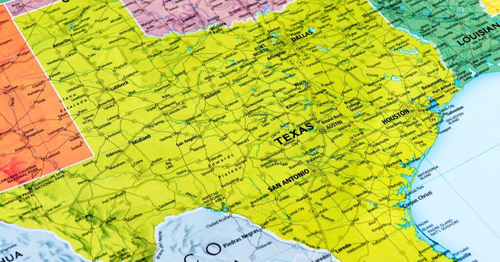 Detailed map of Texas and surrounding areas, highlighting major cities like Austin, Houston, and Dallas, along with highways, rivers, and national parks. The map uses green and yellow tones for land and blue for water, with clear labels for state borders and geographic features. Keywords: Texas smokable hemp ban