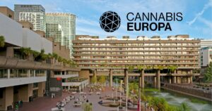 Promotional image for Cannabis Europa cannabis conference featuring the iconic Barbican Centre in London with its brutalist architecture, lush greenery, and a bustling plaza. Overlaid text reads 'CANNABIS EUROPA' alongside a geometric sphere logo, set against a clear blue sky
