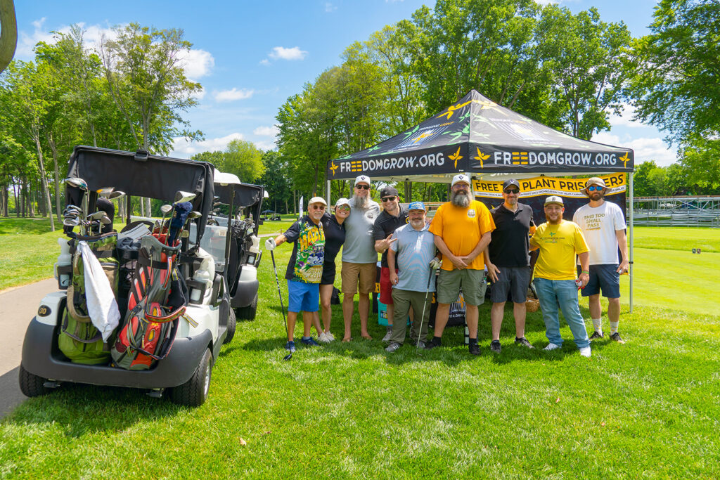 An image of people at a cannabis golfing event