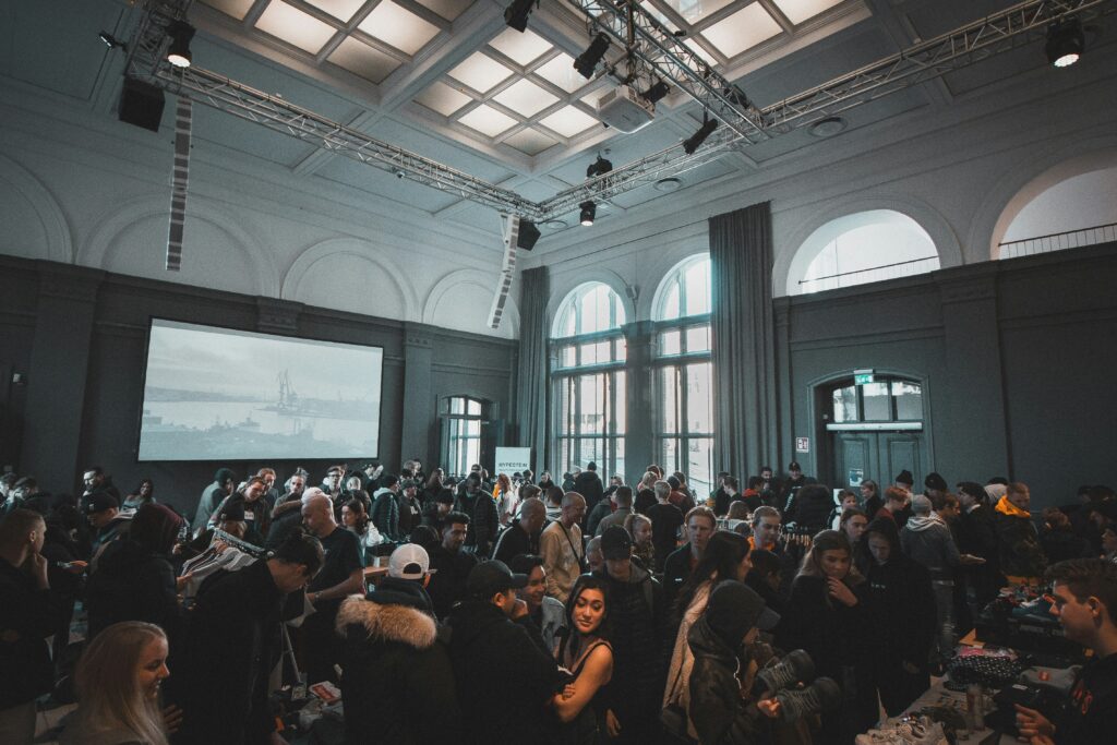 Image of fully packed room with people at an event