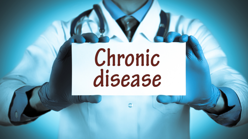 A doctor holding up a sign that says 'chronic disease'