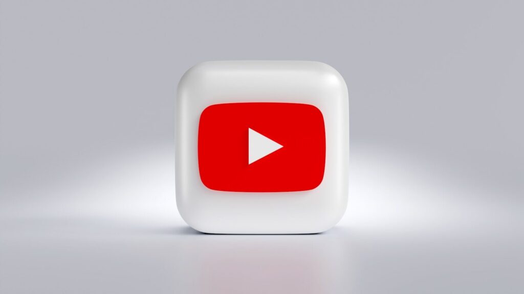 a white square button with a red arrow on it